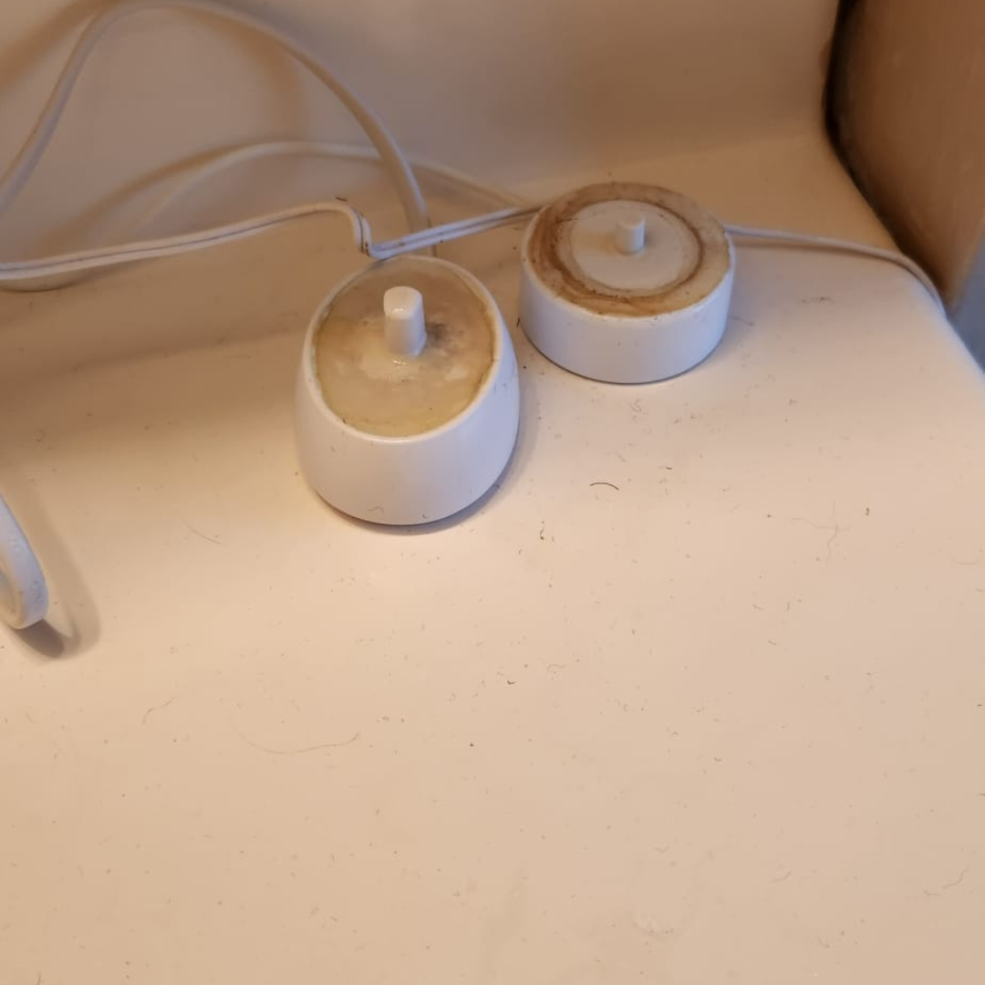JD House Cleaning in Massachusetts Toothbrush holder with stains and buildup before cleaning by JD House Cleaning in Massachusetts