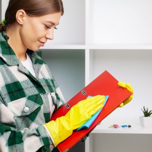 An employee of the cleaning company fulfills orders for office cleaning An employee of the cleaning company fulfills orders for office cleaning